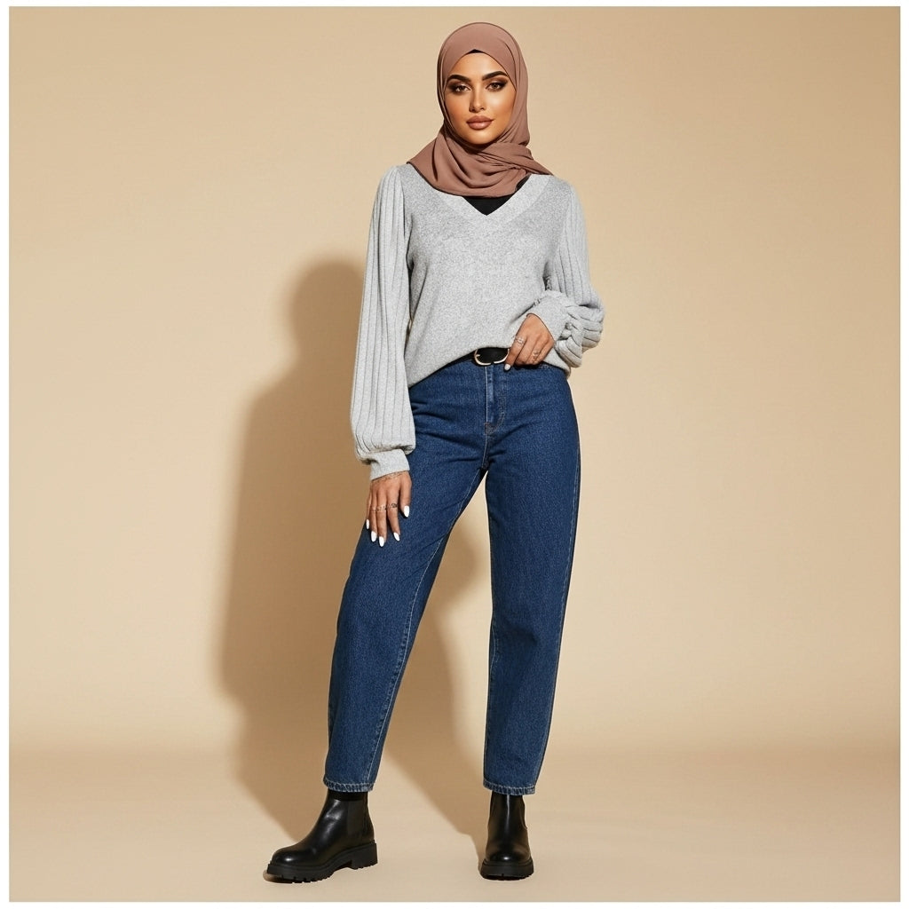 V-neck jumper with balloon sleeves in light Grey worn by a standing hijabi model in front view, showing the V-neckline, ribbed sleeves, relaxed fit, and lightweight knit texture.